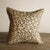 leopard print pattern linen cushion in warm colours with gold and neutrals