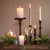 wooden tray styled with artificial plants, flowers and candles.